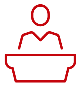 Person behind desk icon